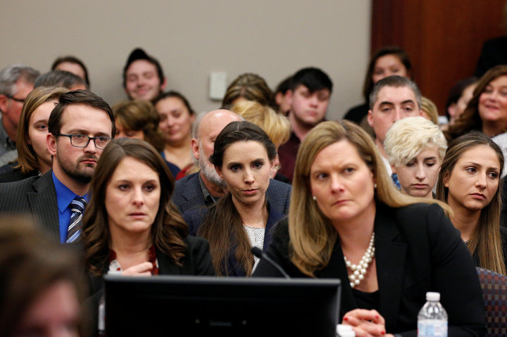 Victim Rachael Denhollander listens as Larry Nassar, a former team USA Gymnastics doctor who pleaded guilty in November 2017 to sexual assault charges, is sentenced in Lansing